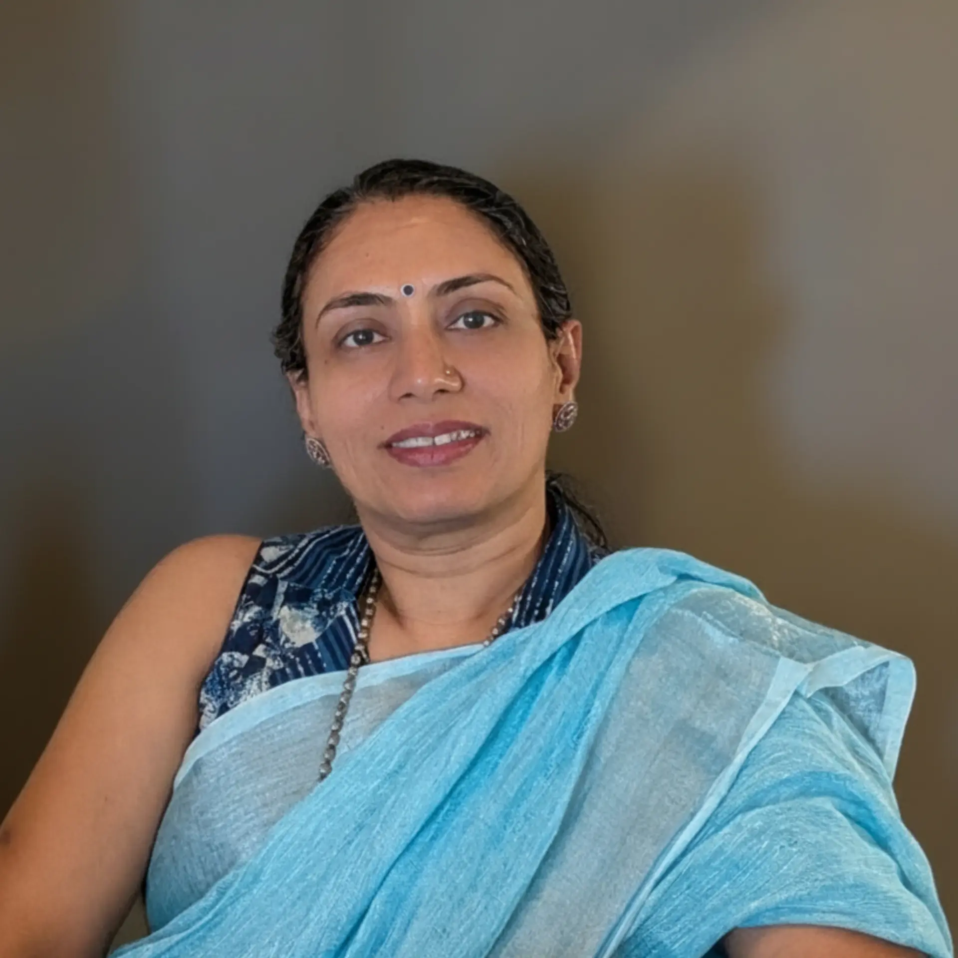 Arti Rejin Geed seated in her consulting office