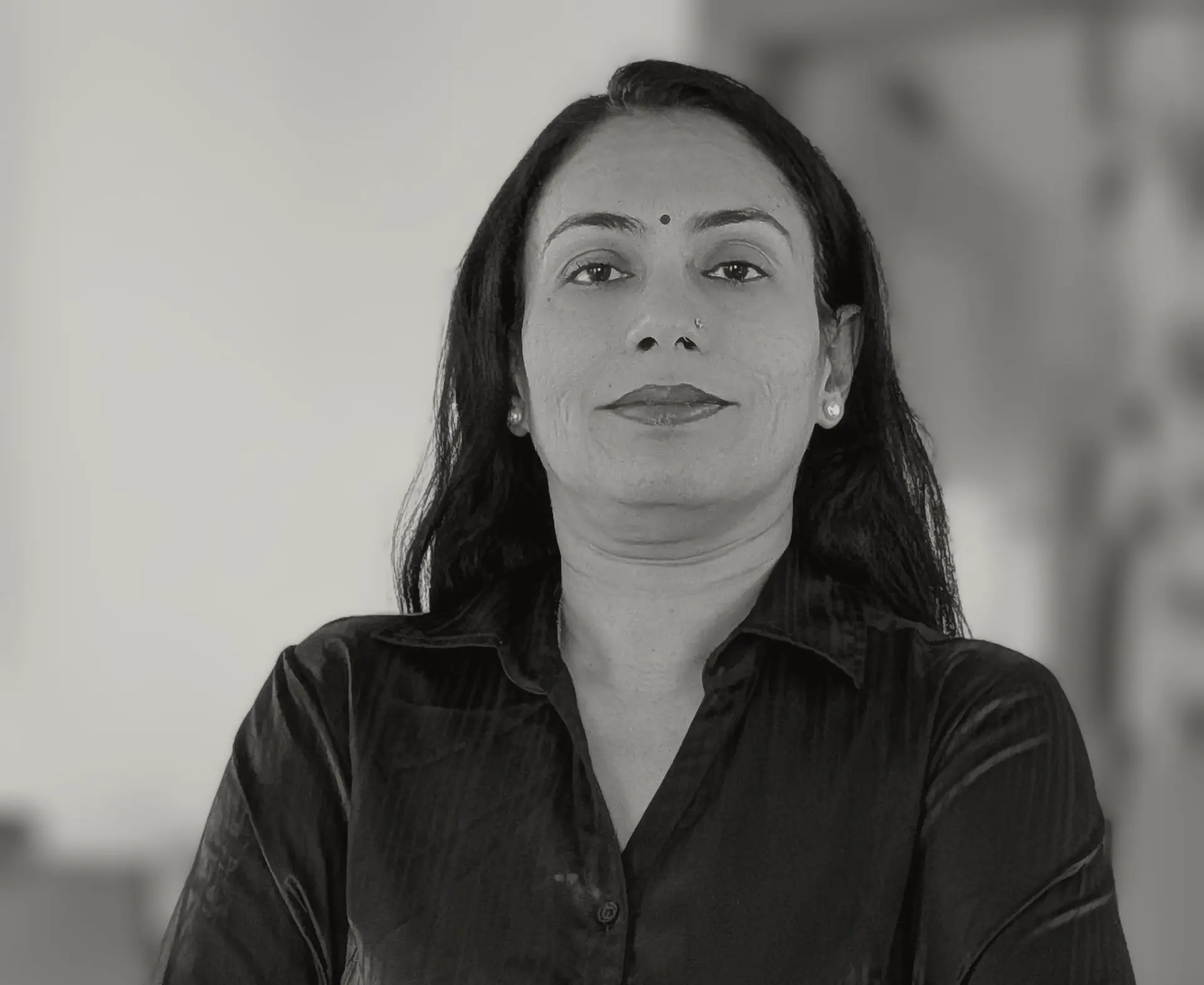 Black and white headshot of Arti Rejin Geed